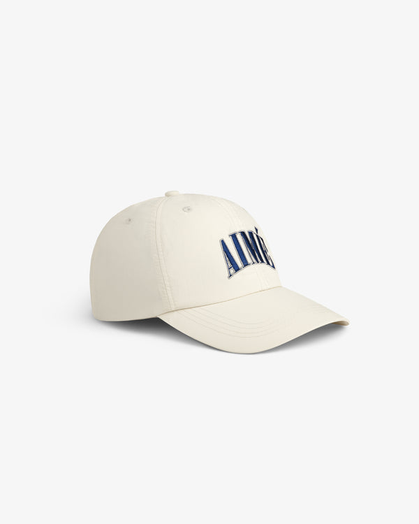 A cream-colored Nylon Crusher Hat with AIMÉ embroidered in large blue letters on the front.
