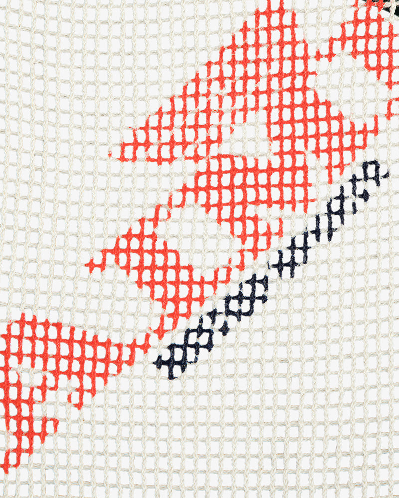 Close-up of the Aimé Painters Hat featuring white mesh and red and black geometric patterns.