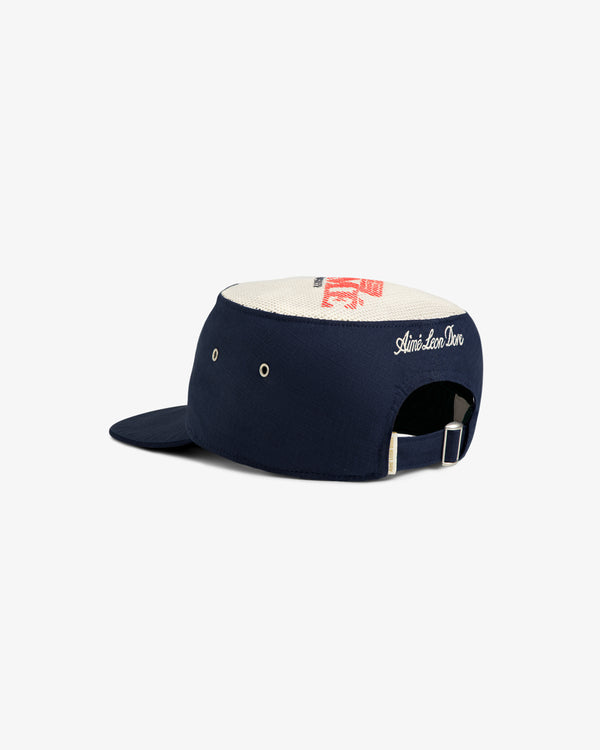 Aimé Painters Hat in navy and white with adjustable strap and Slim-Skin Dom embroidered on the back.