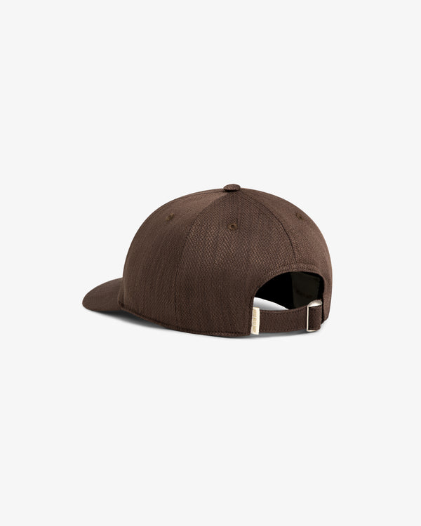 Linen Blend Heritage Hat in brown, shown from the back with adjustable strap and metal buckle on white background.