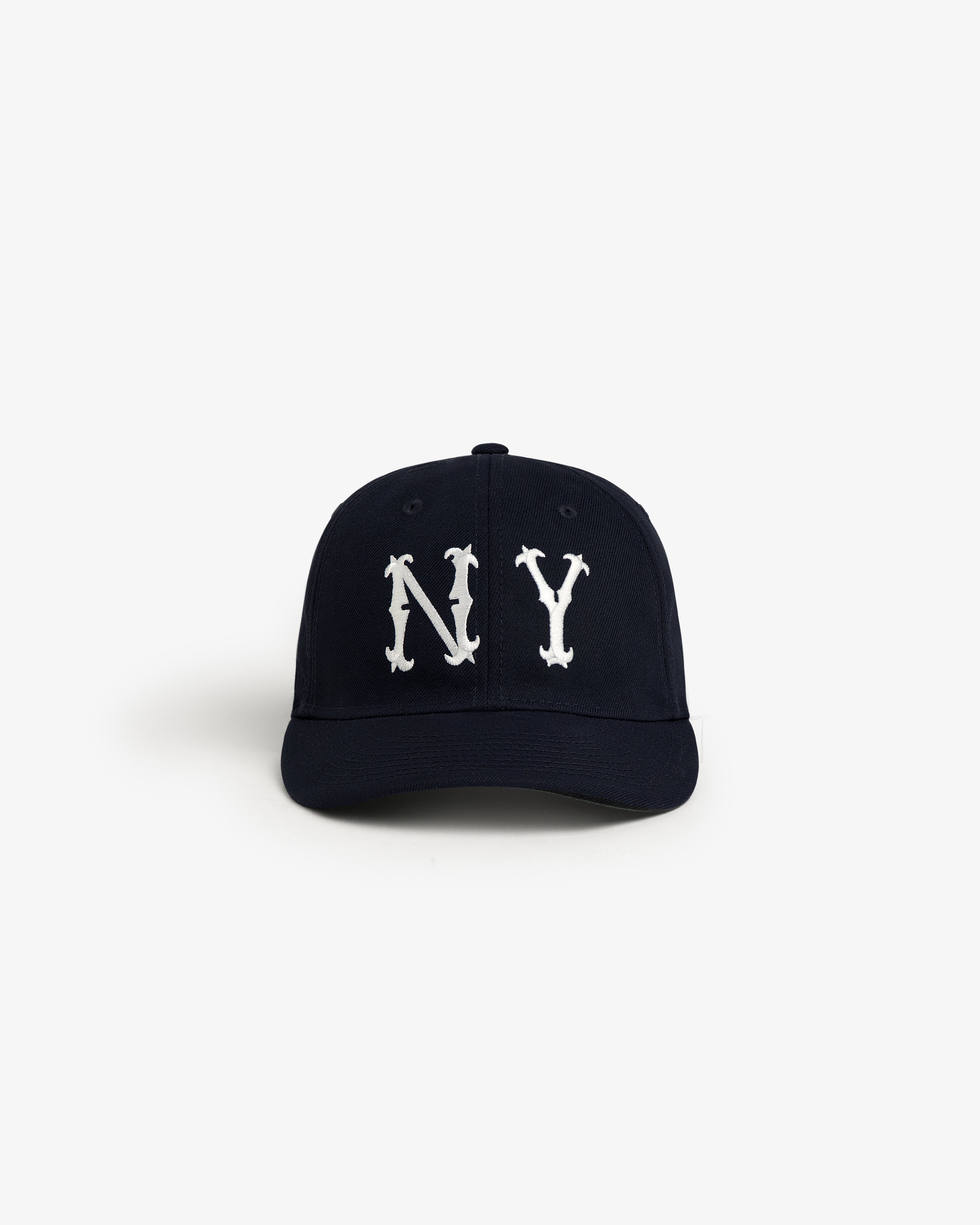 The ALD / New Era Highlanders Retro Fit Hat is a black cap with bold white NY letters on the front, shown on white.