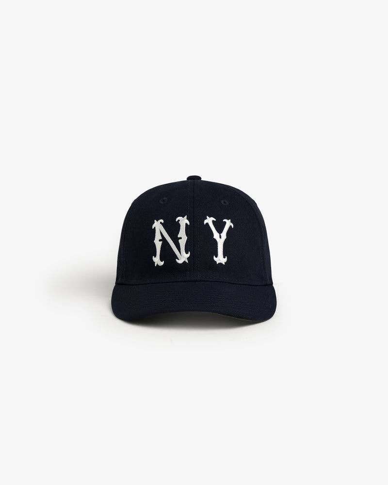 The ALD / New Era Highlanders Retro Fit Hat is a black cap with bold white NY letters on the front, shown on white.