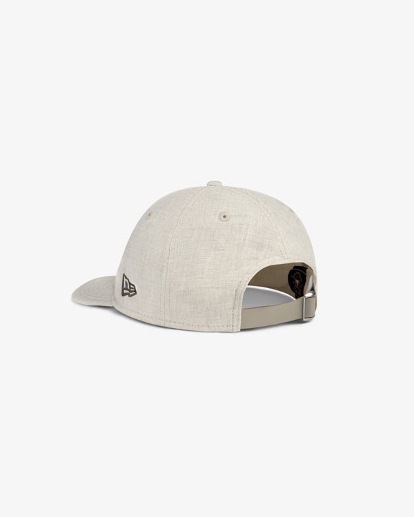 ALD / New York Yankees Retro Fit Hat in beige, back view with adjustable strap and small black logo on left side.