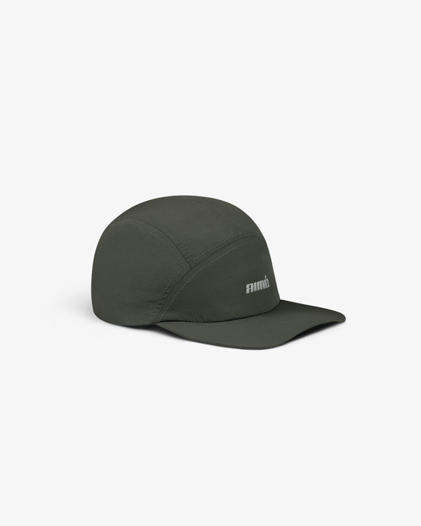 Aimé Performance Sport Hat in dark green with curved brim and small white logo, shown on a plain white background.