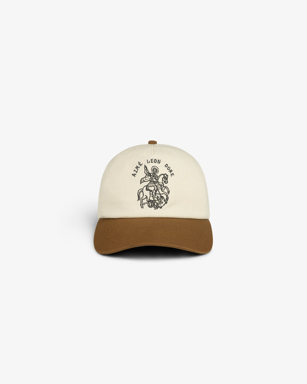 Cream and brown Saint George Logo Hat with line drawing and AIME LEON DORE text on the front.
