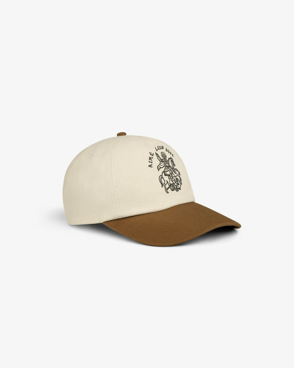 Saint George Logo Hat: beige baseball cap with brown brim and black line drawing with text on the front.