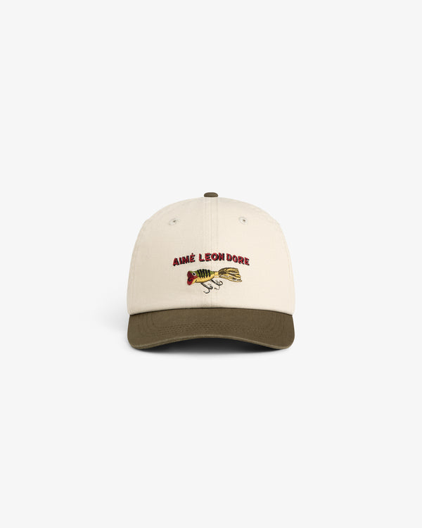 Colorblock Lure Hat: beige cap with olive green brim, Aimé Leon Dore and fish graphic embroidered on front.