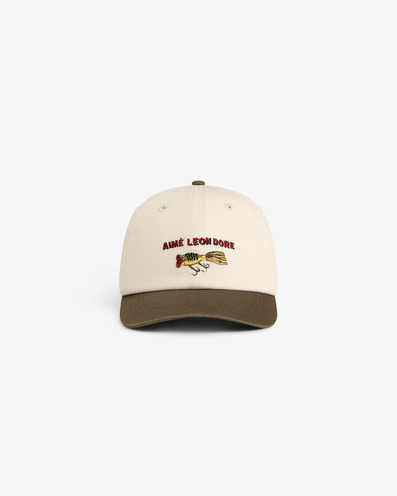 Colorblock Lure Hat: beige cap with olive green brim, Aimé Leon Dore and fish graphic embroidered on front.