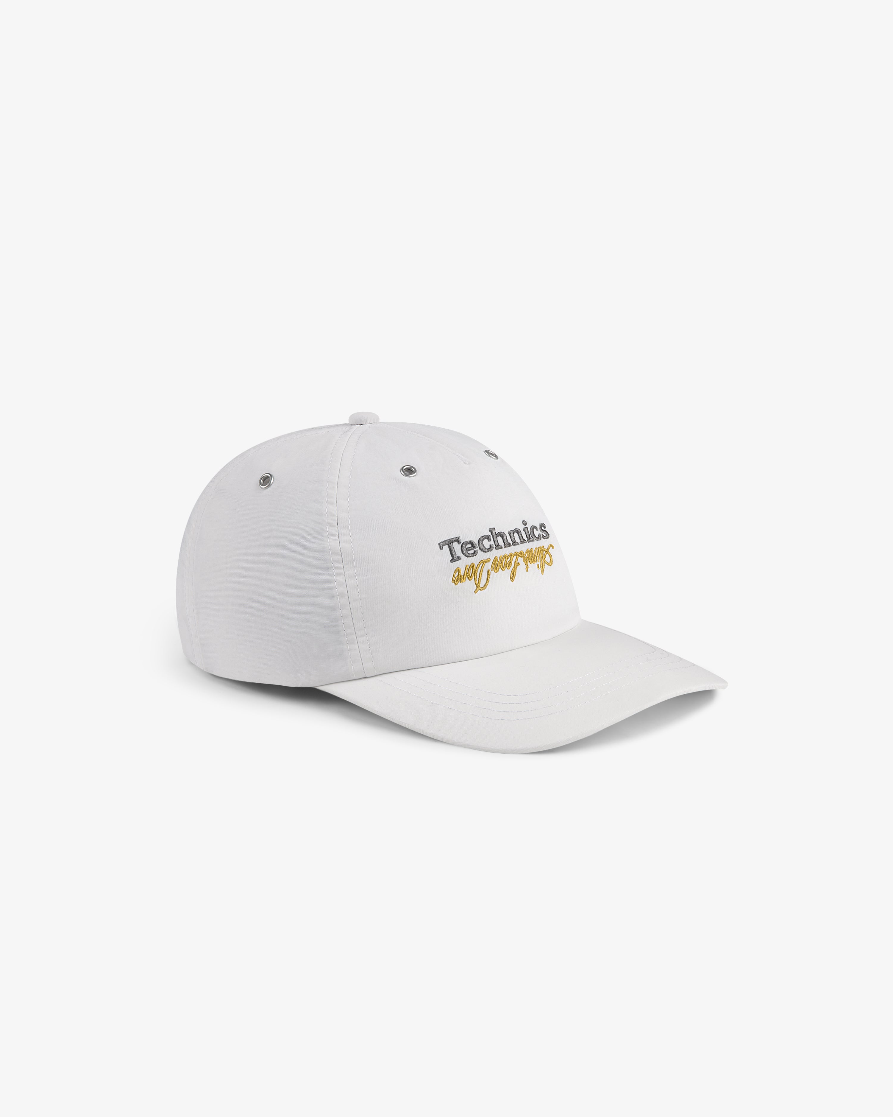 ALD / Technics Nylon Logo Hat with "Technics" and "allways" embroidered on front in black and yellow text.