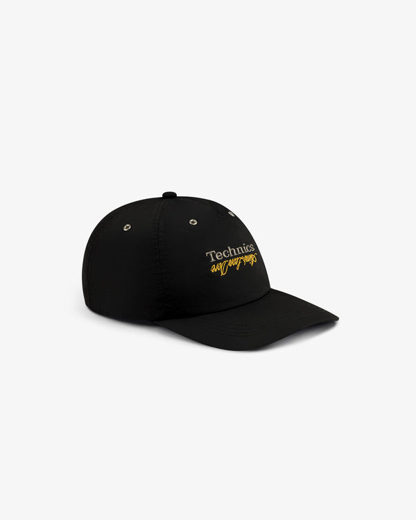 Black ALD / Technics Nylon Logo Hat with white and yellow embroidered branding on the front.