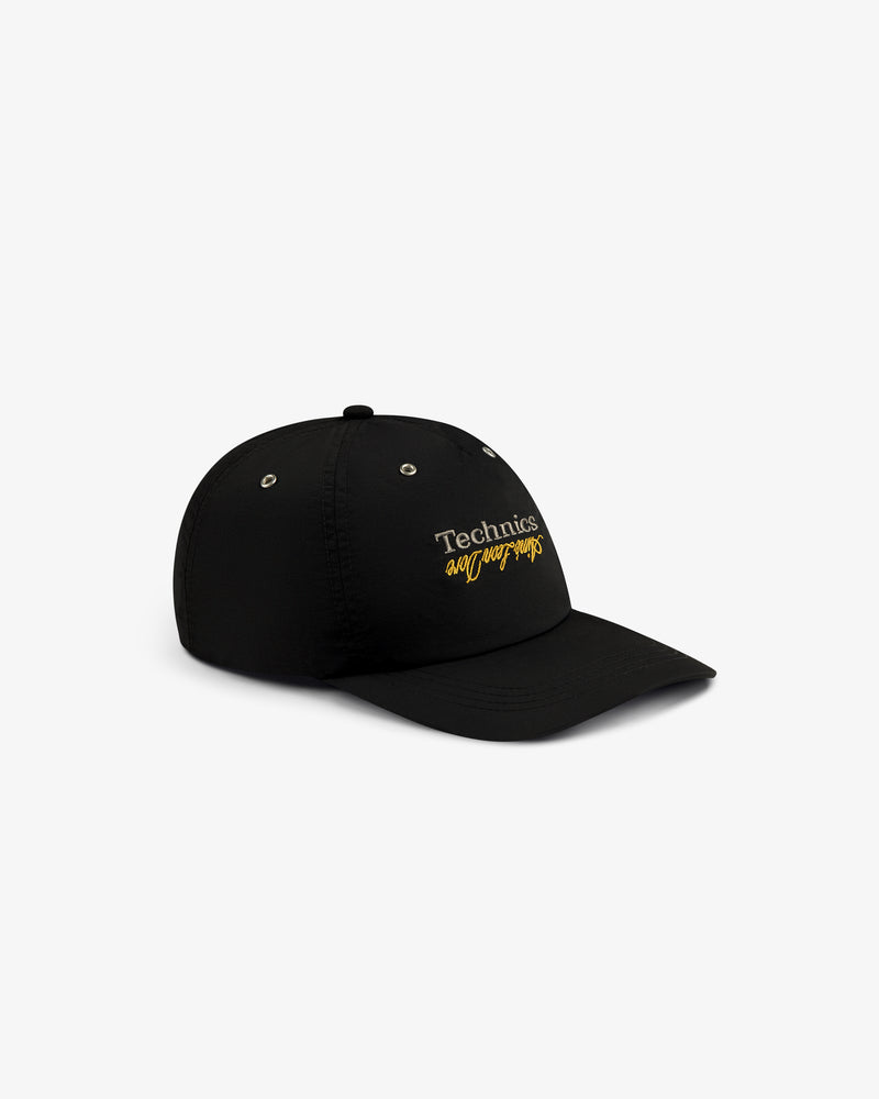 Black ALD / Technics Nylon Logo Hat with white and yellow embroidered branding on the front.