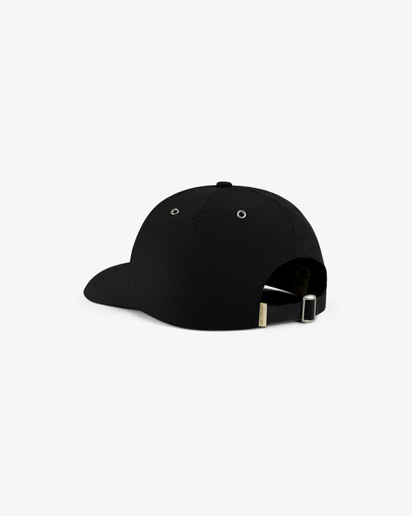 The ALD / Technics Nylon Logo Hat is black, shown from the back, with an adjustable strap and metal clasp.