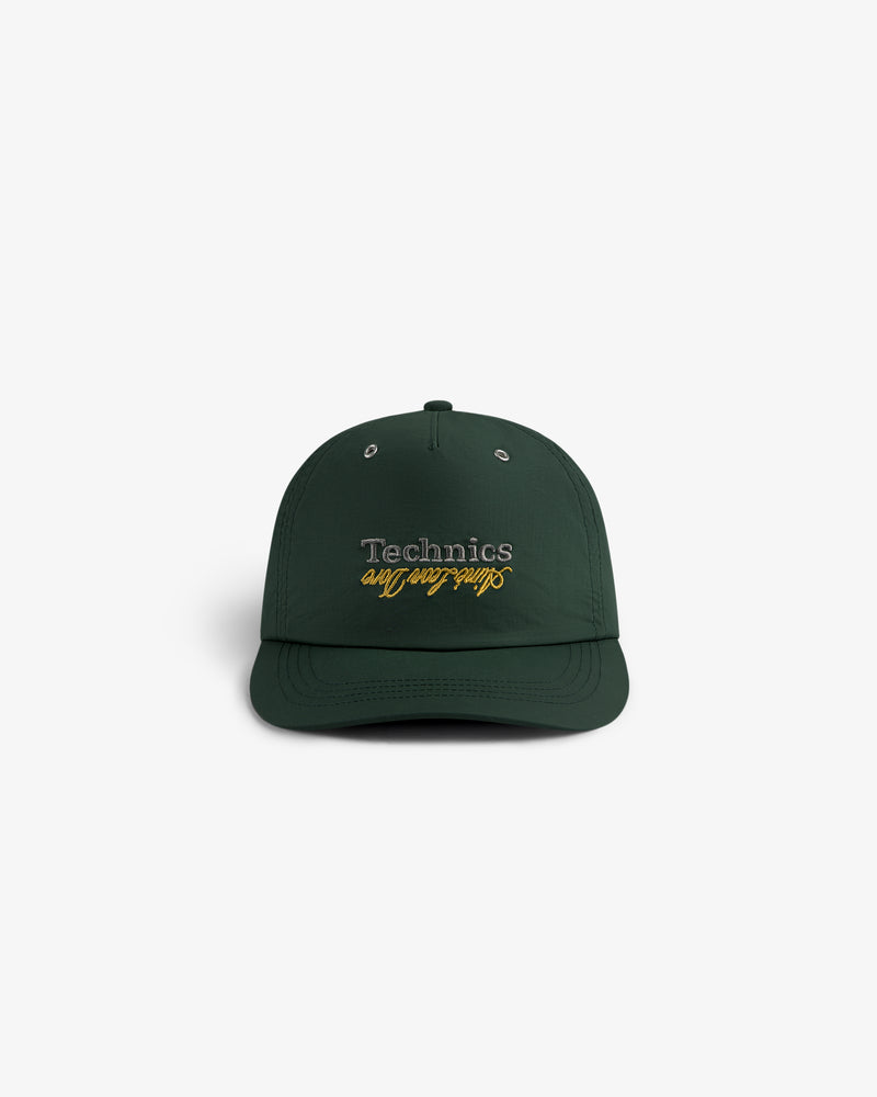 ALD / Technics Nylon Logo Hat in dark green with "Technics on Saturdays" embroidered on the front, shown on white.
