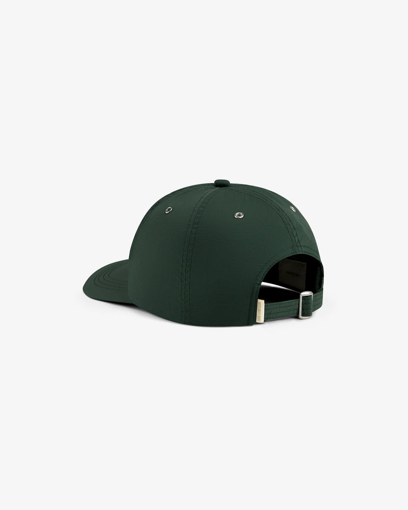 ALD / Technics Nylon Logo Hat in dark green, shown from the back with adjustable strap and metal buckle on white background.