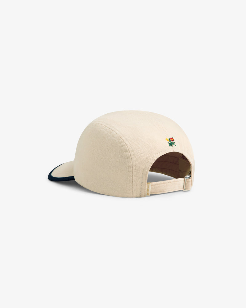 Back view of Souvenir Fishing Hat in beige with adjustable strap and small colorful embroidery above the opening.