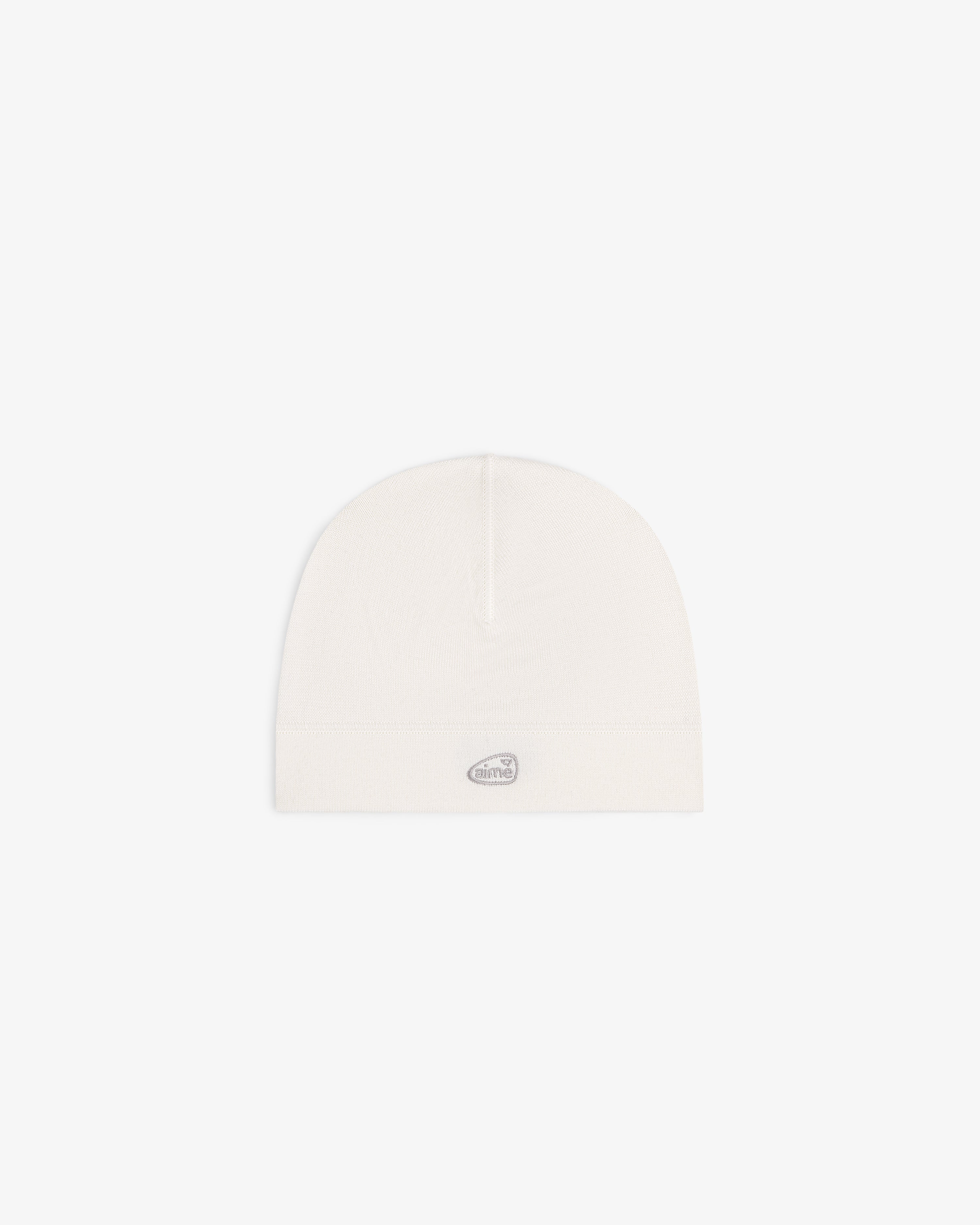 ALD Golf Skull Cap in off-white with a small oval silver logo patch on the front, shown on a white background.