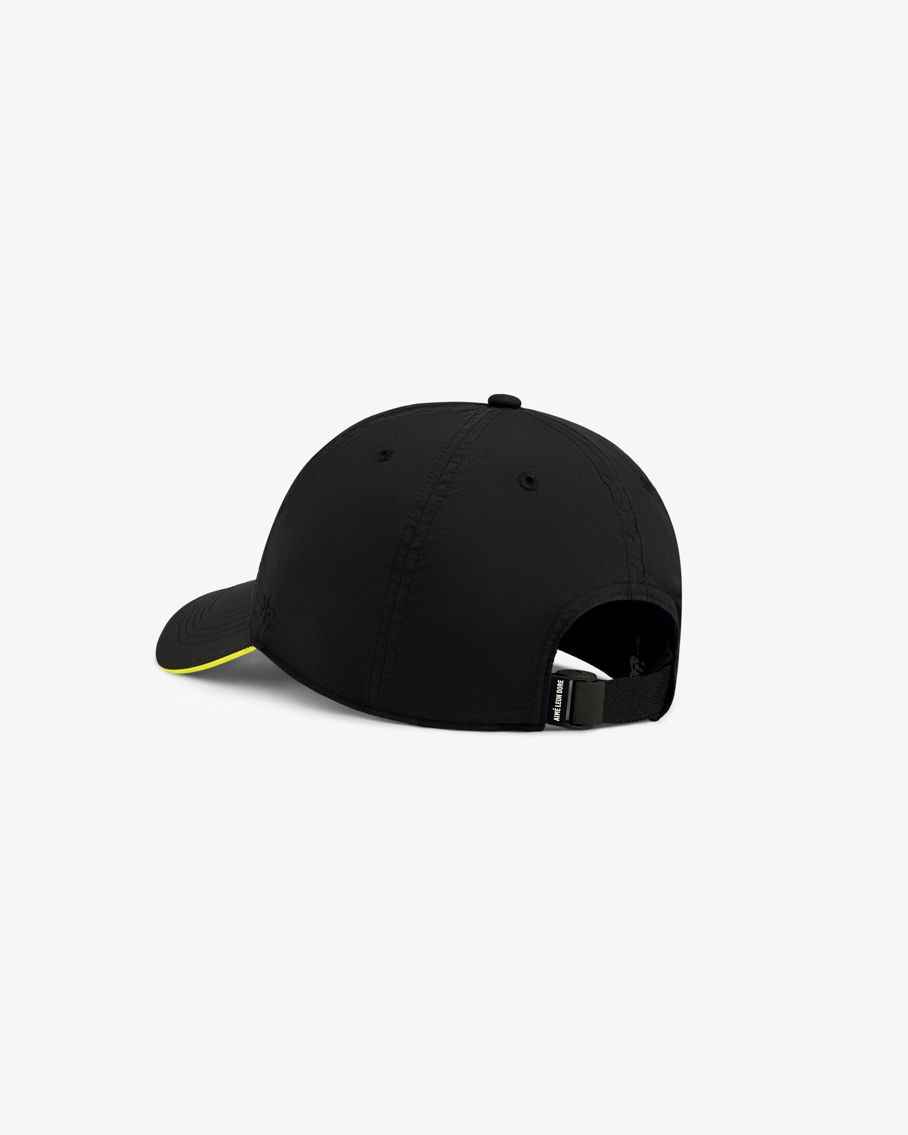 Back view of the ALD / New Balance Running Hat in black with curved brim, yellow edge detail, and adjustable strap.
