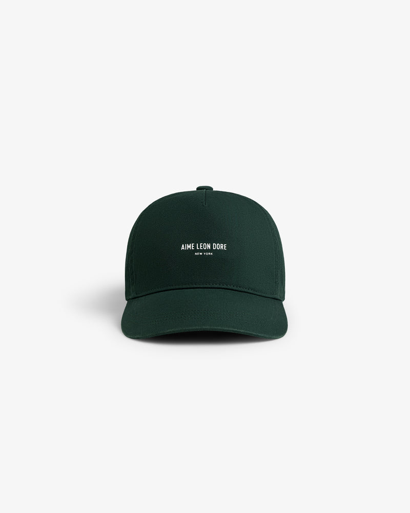 A dark green Micro Logo Hat with AIME LEON DORE NEW YORK embroidered in white on the front.