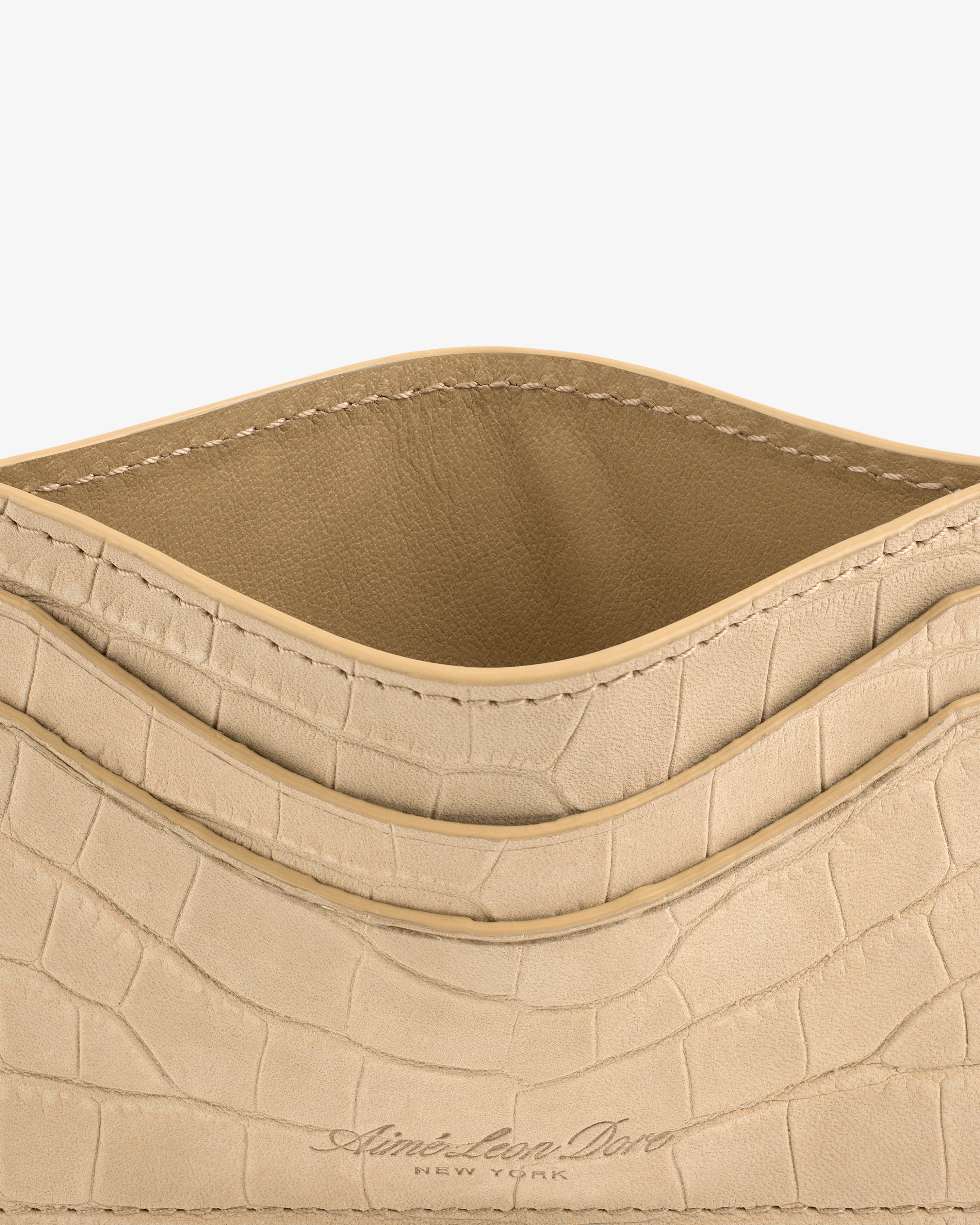 Croc-Embossed Nubuck Cardholder with open pocket and Aimé Leon Dore New York embossed at the bottom.