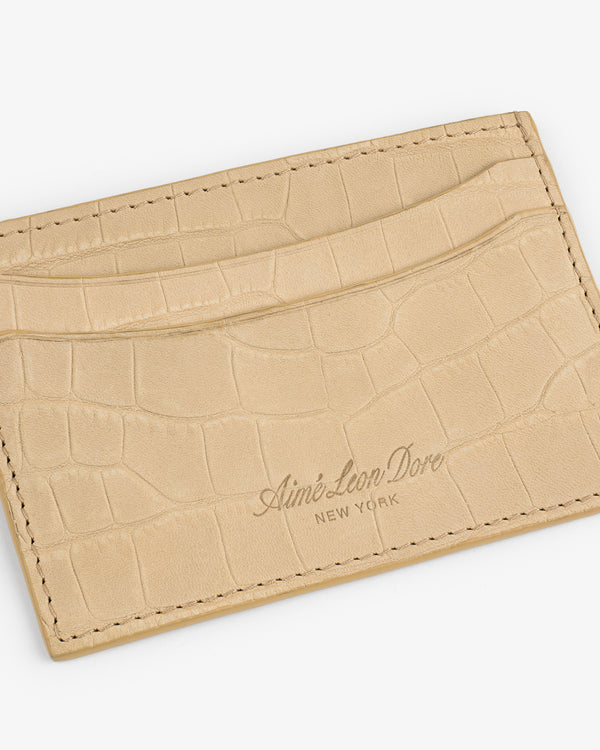 Croc-Embossed Nubuck Cardholder in beige with Aimé Leon Dore New York embossed on the front.