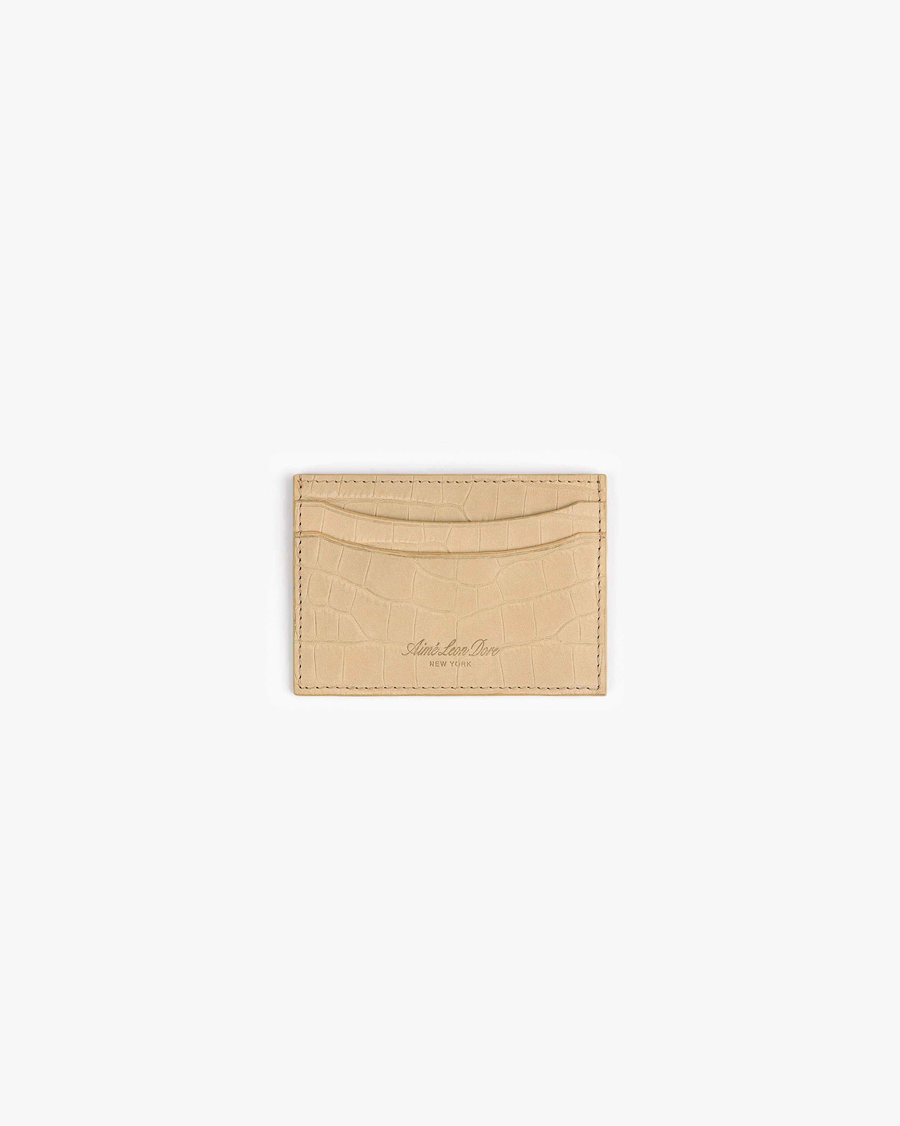 Beige Croc-Embossed Nubuck Cardholder with two slots and subtle detailing, centered on a white background.