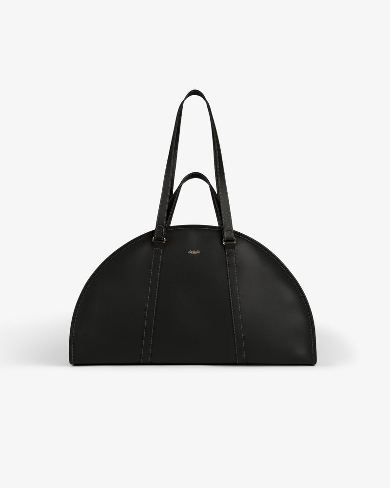 A black Full Grain Leather Weekender Bag with two handles, semi-circular shape, on a plain white background.