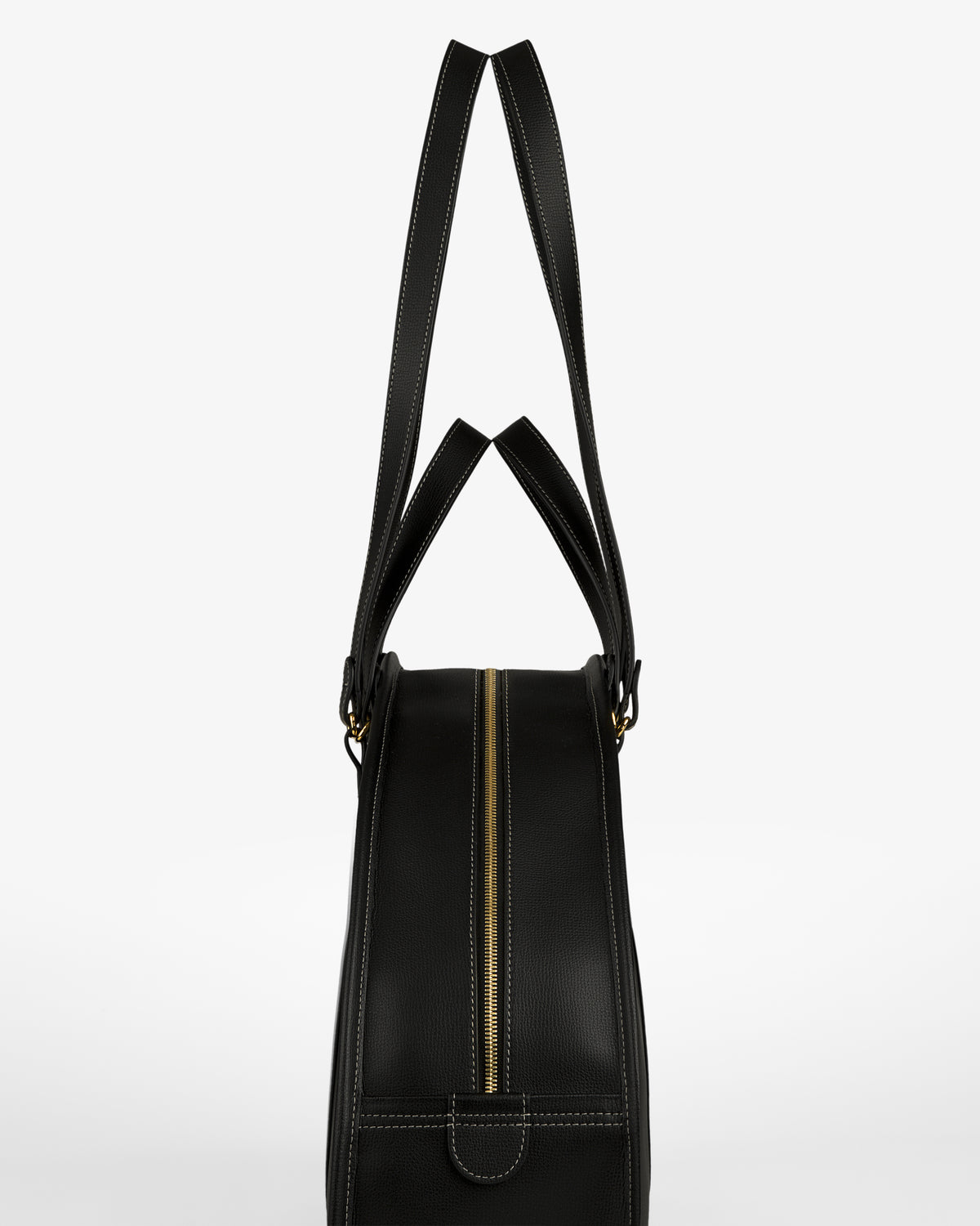 Full Grain Leather Weekender Bag in black, with gold zipper and double handles, shown side view on white background.