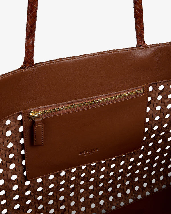 Close-up of Woven Leather Tote Bag in brown with braided handles and an interior zip pocket.