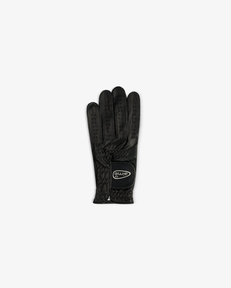 The ALD / FootJoy StaSof Heritage Glove (Left) is black with ventilation holes and a wrist logo patch.
