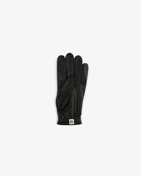 The ALD / FootJoy StaSof Heritage Glove (Left) is black leather with vents and an FJ logo on the wrist.