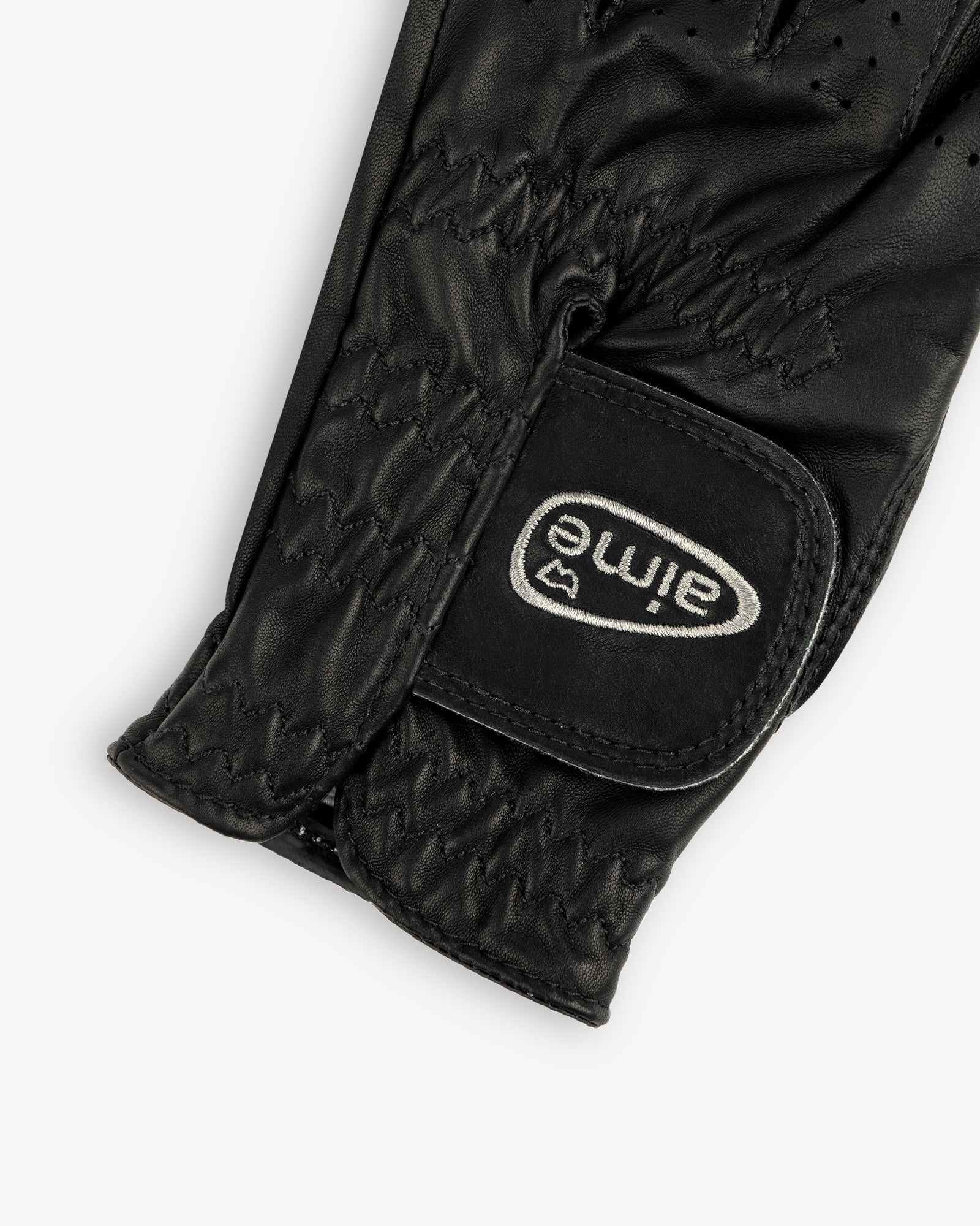 Close-up of the ALD / FootJoy StaSof Heritage Glove (Left) in black leather with visible stitching and aimé velcro strap.