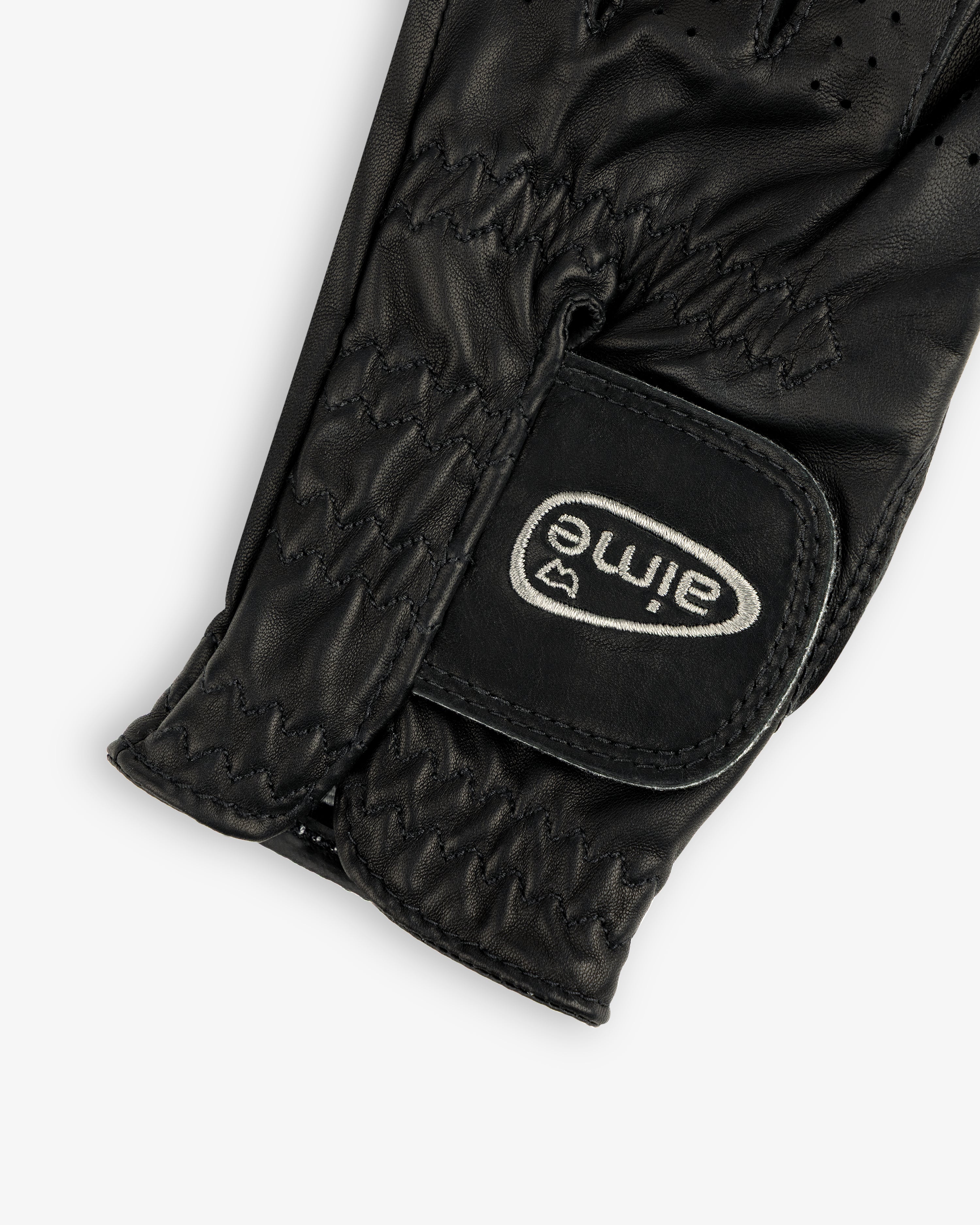 Close-up of the ALD / FootJoy StaSof Heritage Glove (Left) in black leather with visible stitching and aimé velcro strap.