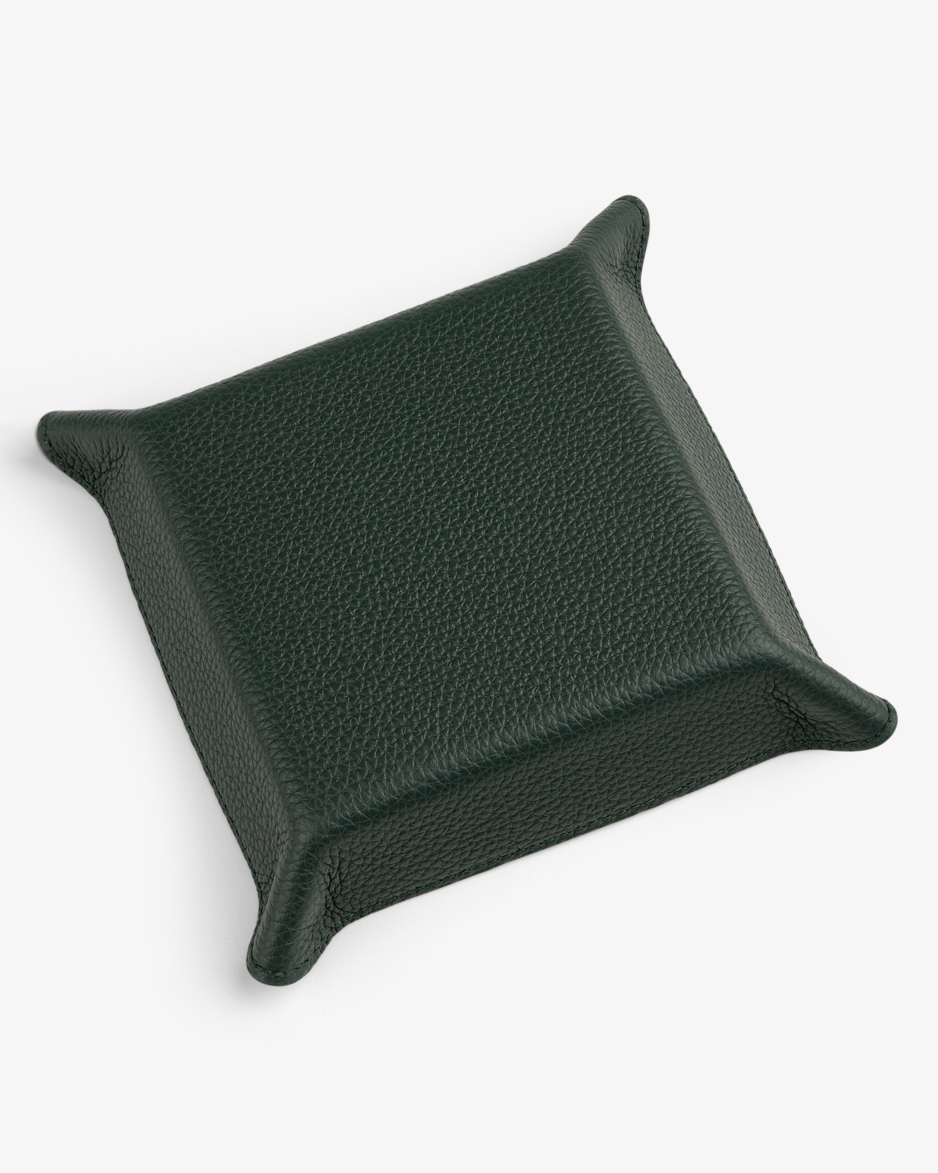 A square, dark green Leather Catchall tray with raised, pointed corners on a white background.