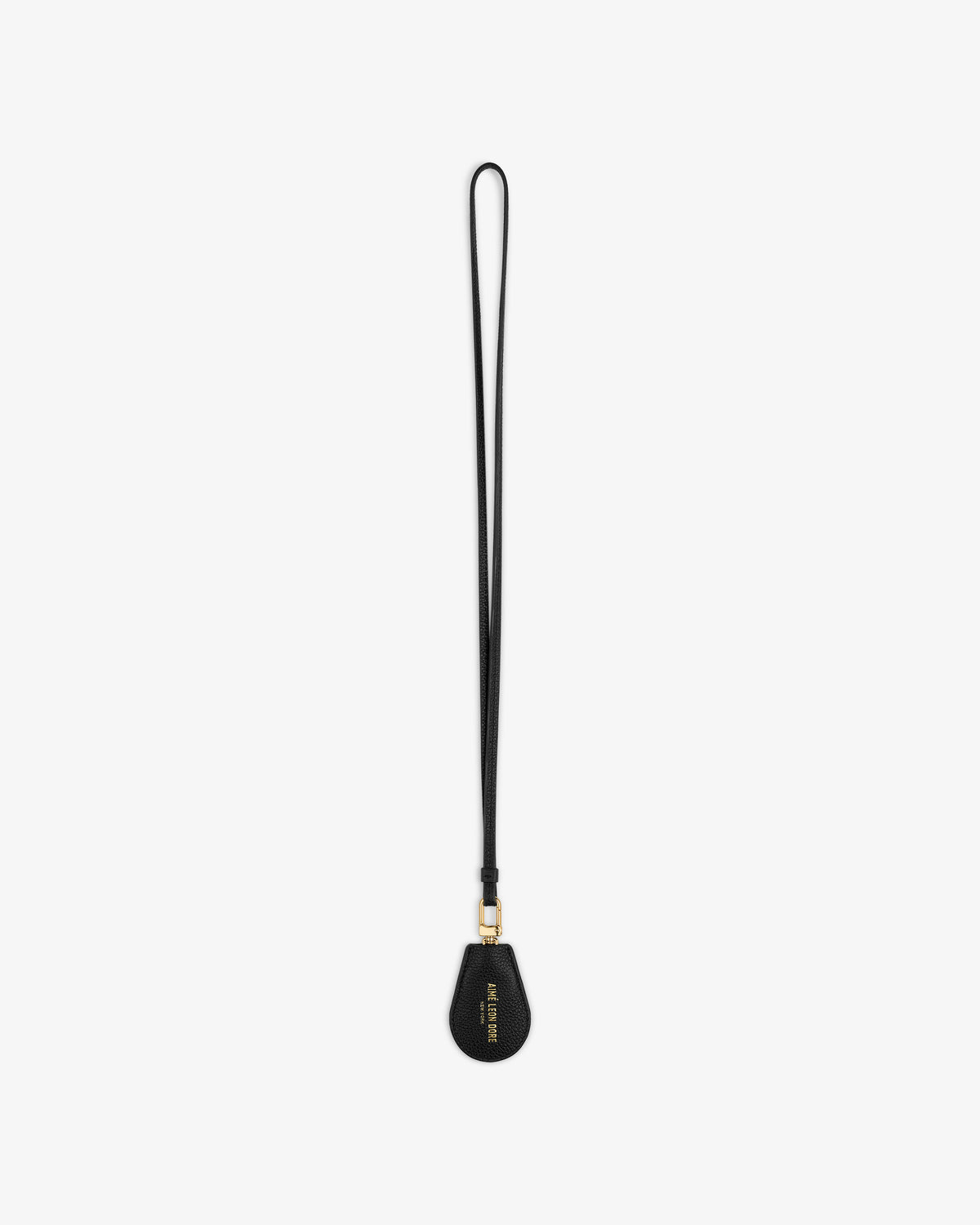 Black Leather Key Cover by Louis Vuitton with gold hardware and wrist strap, shown on a white background.