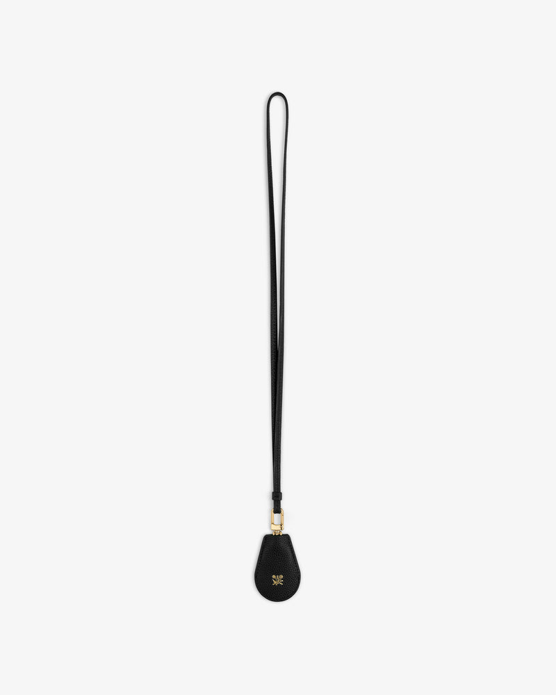 Leather Key Cover in black with teardrop attachment and gold hardware, shown on a white background.