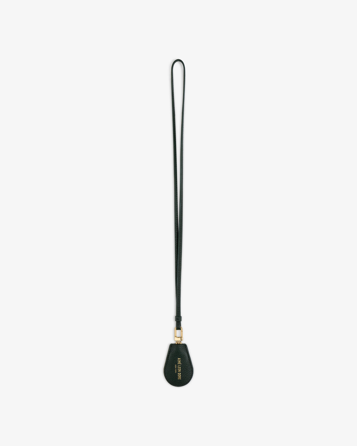 A black Leather Key Cover with a teardrop-shaped tag and gold hardware, shown on a white background.