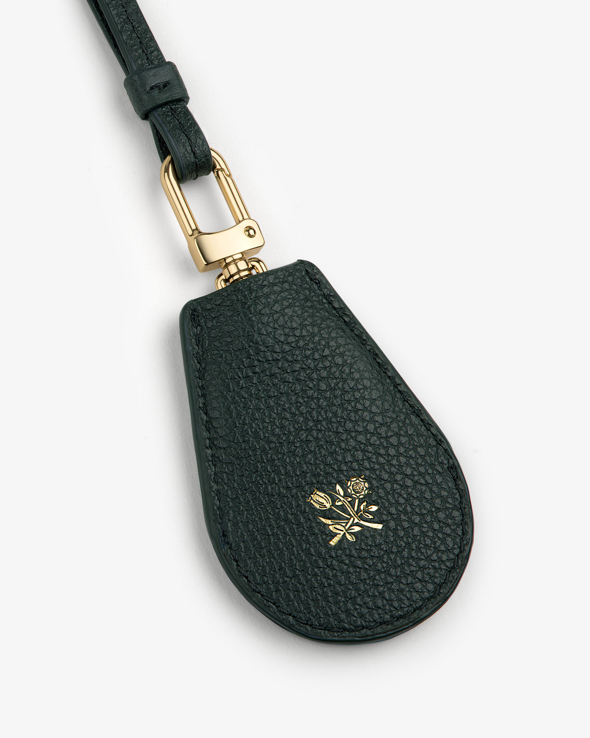 Leather Key Cover in black leather with gold hardware and an embossed small gold rose on the front.