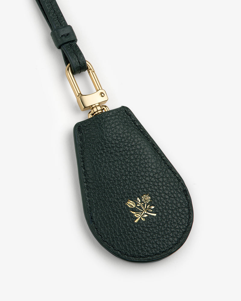 Leather Key Cover in black leather with gold hardware and an embossed small gold rose on the front.