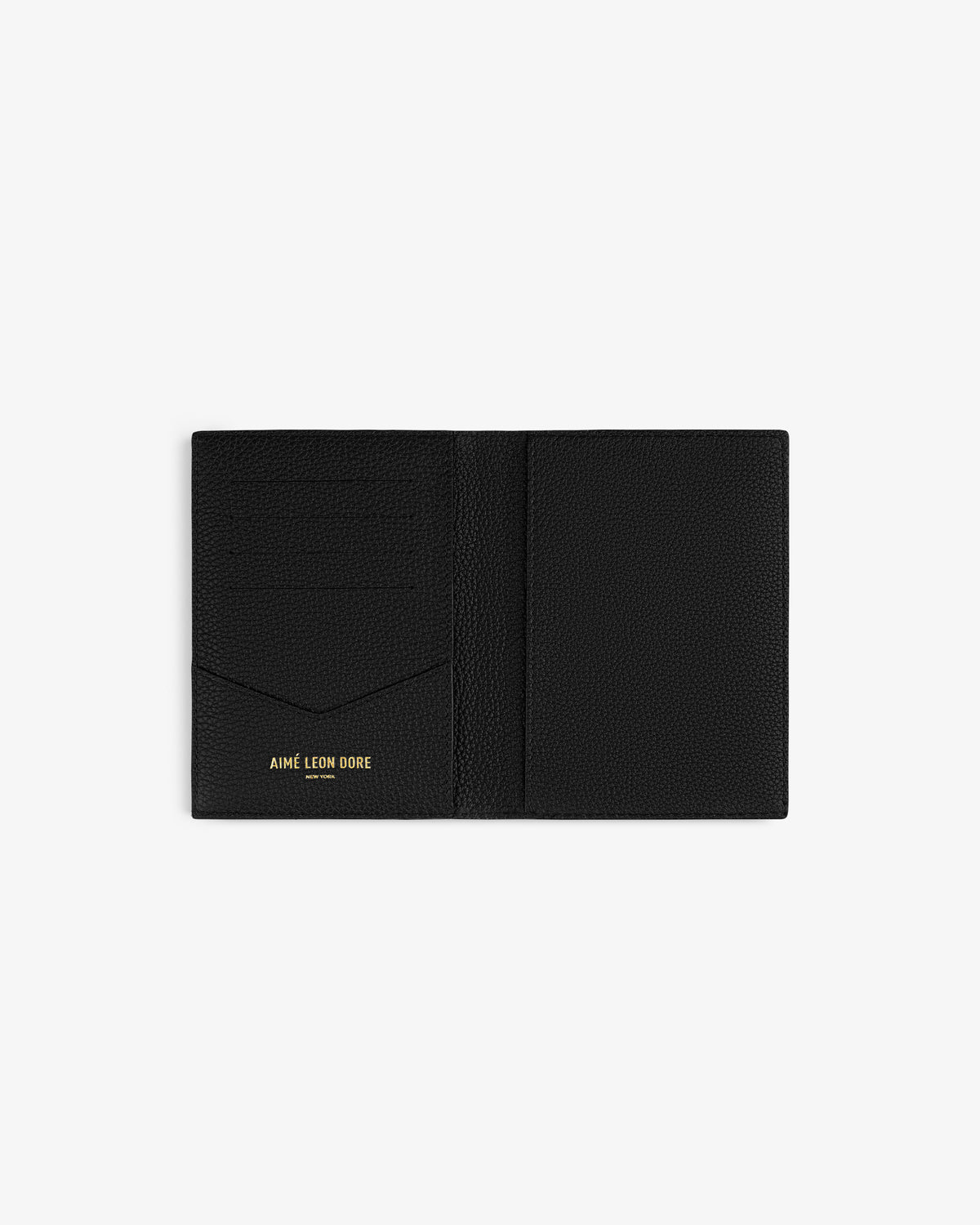Black leather passport holder with multiple slots and AIMÉ LEON DORE in gold on the bottom left inside flap.