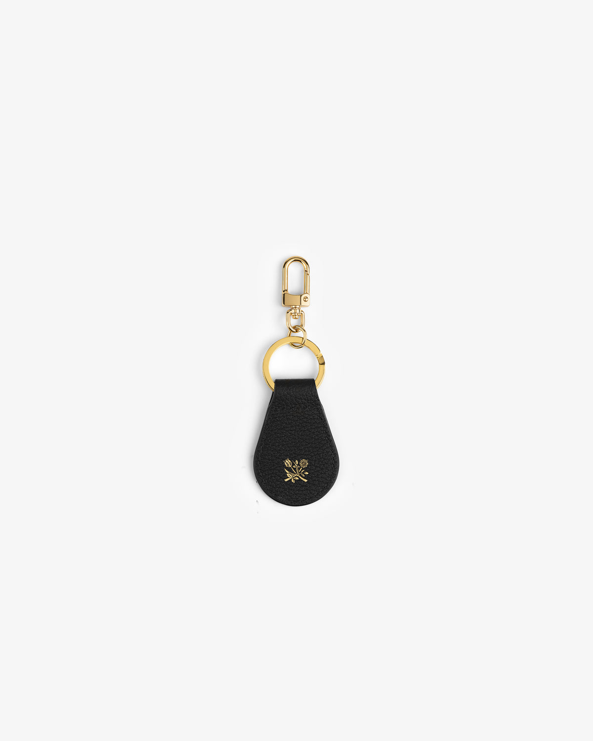 Leather Key Fob in black leather with gold hardware and a small gold emblem on the front, on white background.