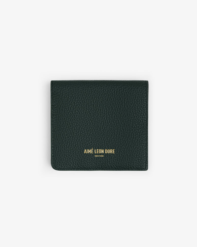 Dark green Leather Bi-Fold Wallet with gold Aimé Leon Dore branding on the front, shown on a white background.