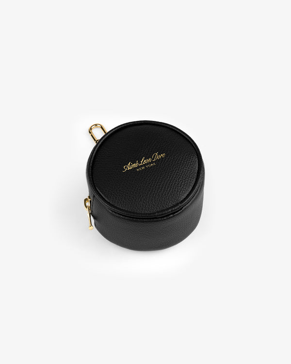 Full Grain Leather Keychain Pouch in black with gold zippers and Aimé Leon Dore logo, shown on a white background.
