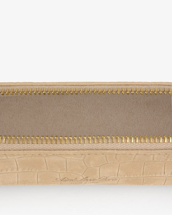 Close-up of an open Croc-Embossed Nubuck Pencil Case with a gold zipper and fabric lining.