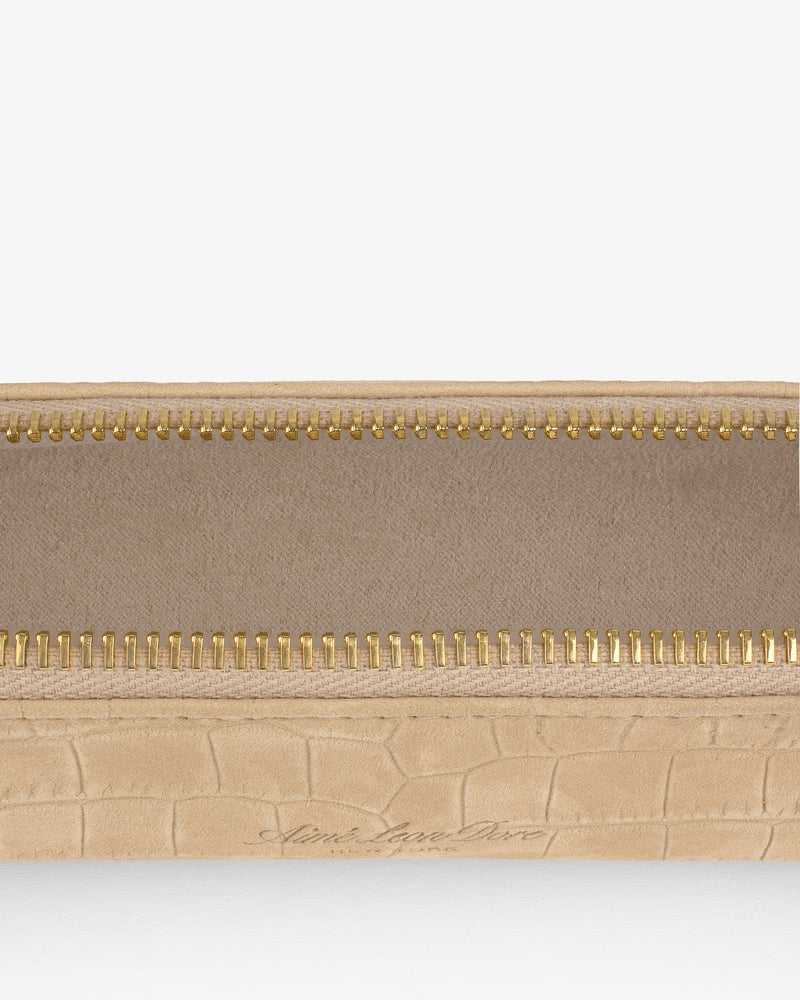 Close-up of an open Croc-Embossed Nubuck Pencil Case with a gold zipper and fabric lining.