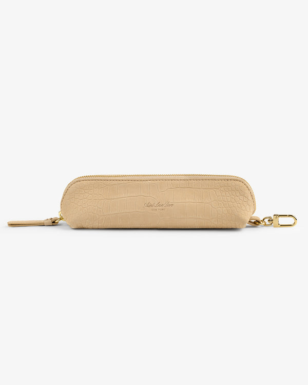 Croc-Embossed Nubuck Pencil Case in beige with gold clip, shown on a plain white background.