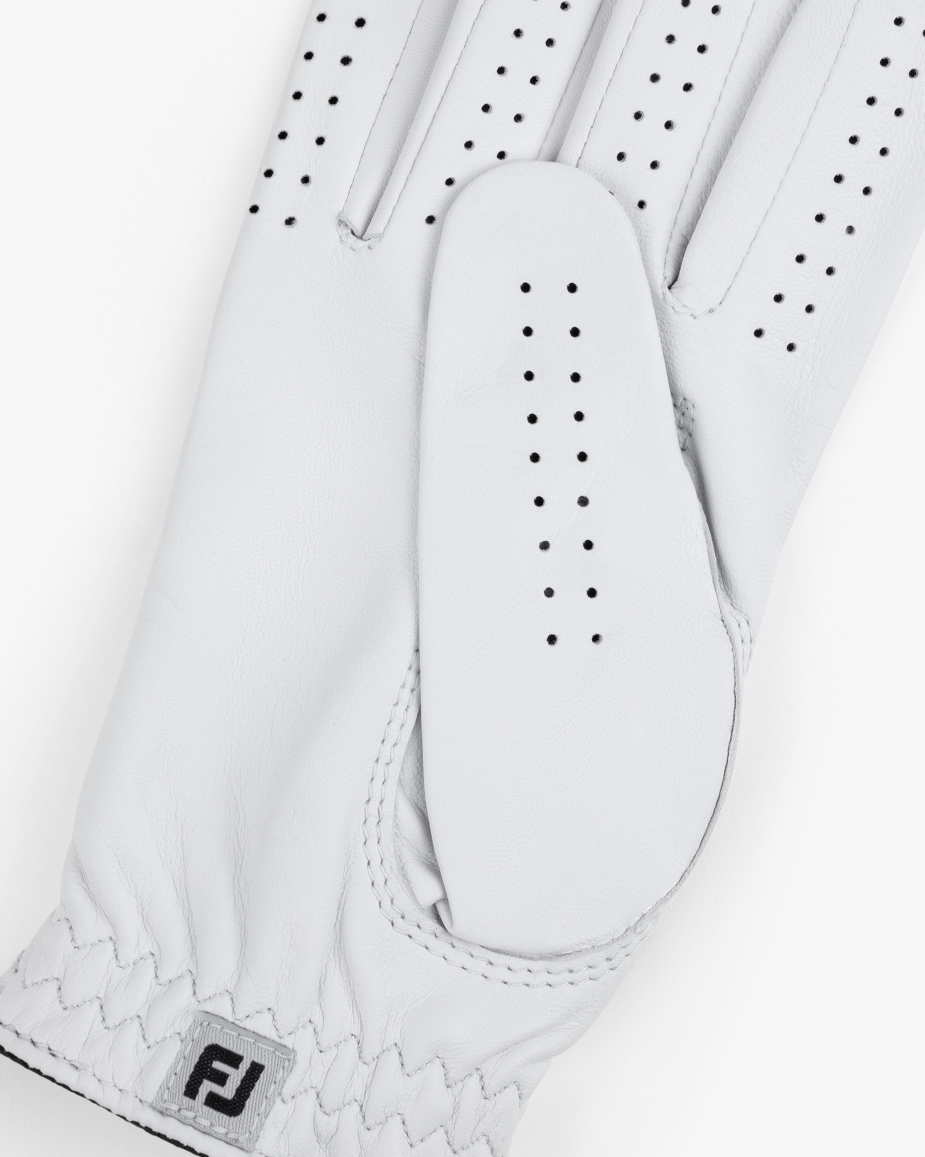 The ALD / FootJoy StaSof Heritage Glove (Right) is a white leather glove with perforations and an FJ cuff logo.