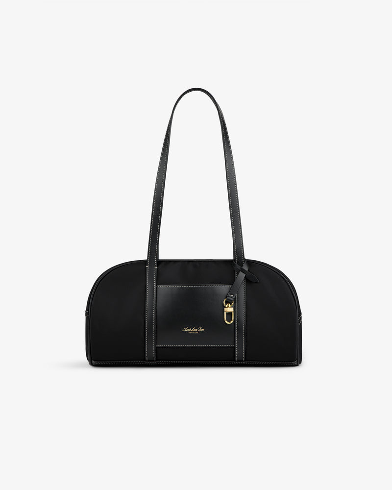 Mini Duffle Shoulder Bag in black with long straps, gold-tone hardware, and small front logo on white background.