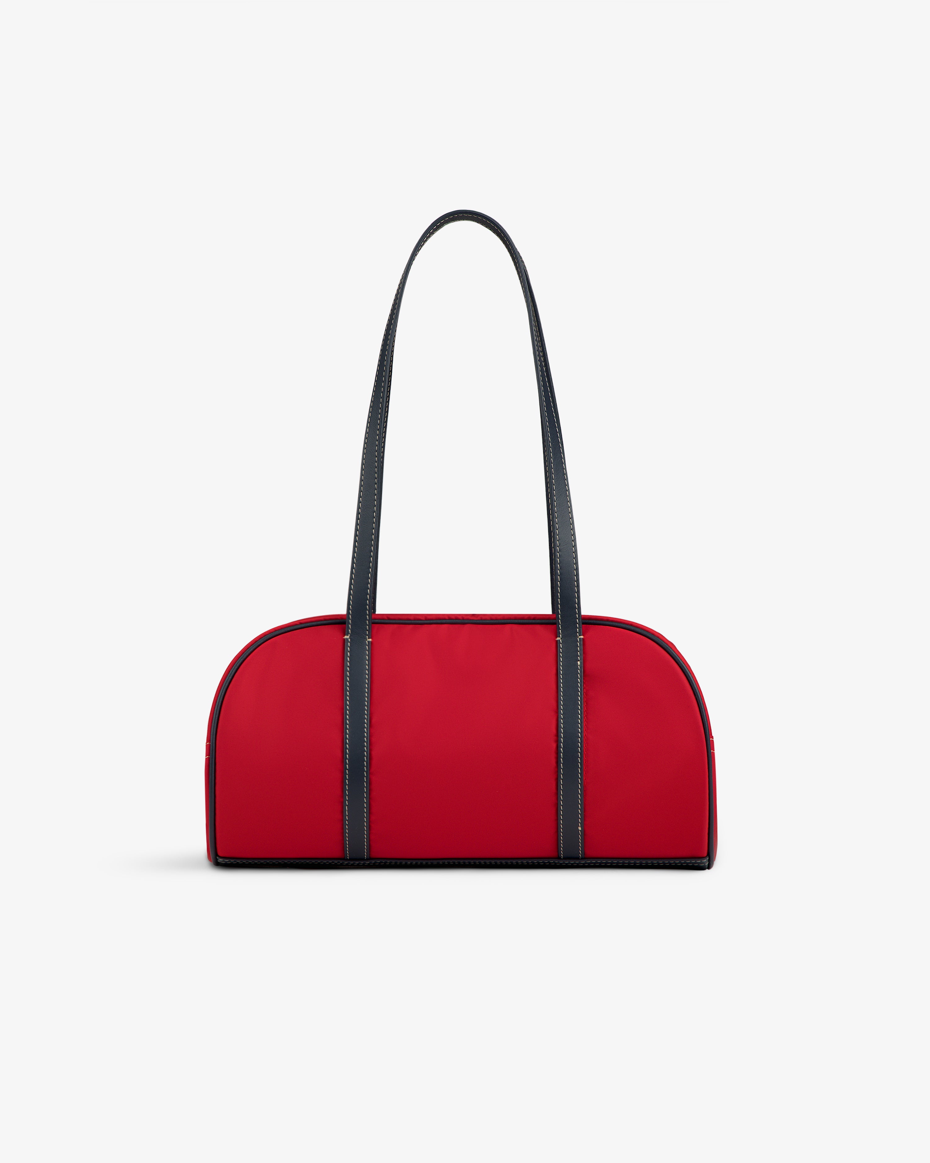 Mini Duffle Shoulder Bag in red with long black straps, displayed on a plain white background.