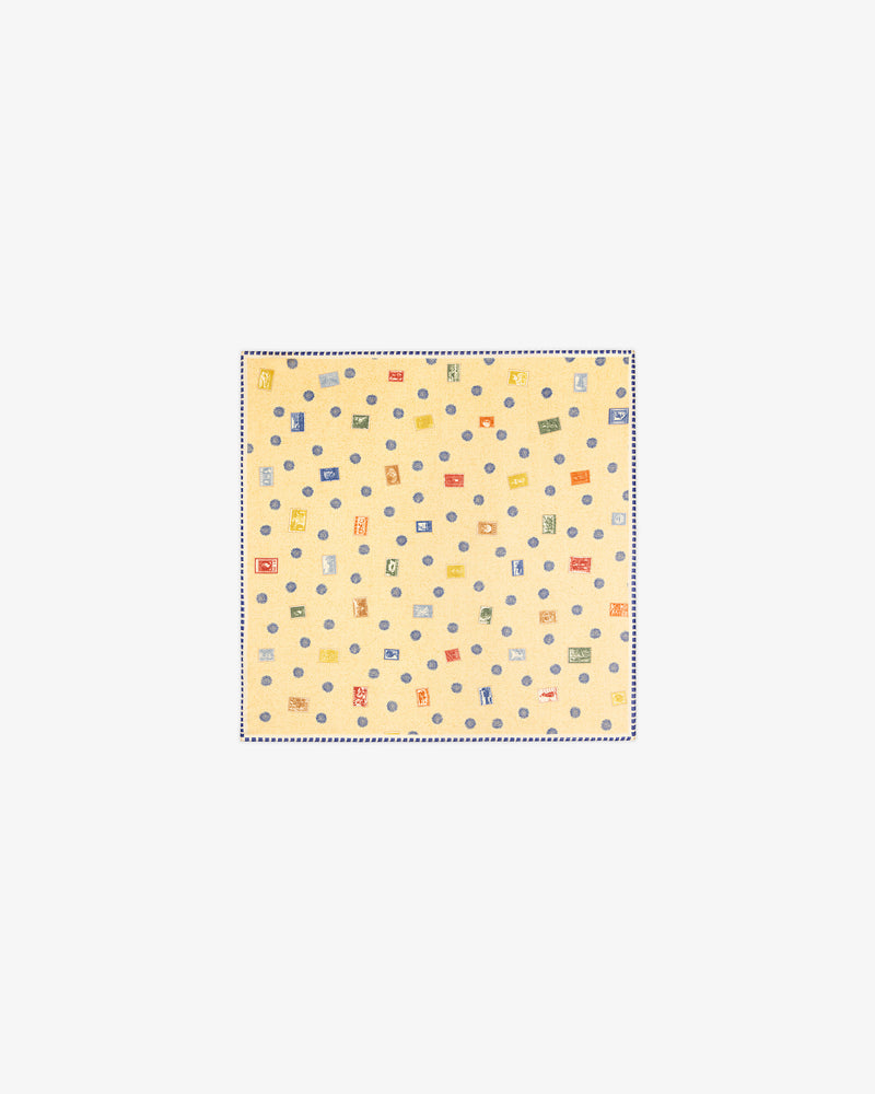 The Vintage Stamps Wool Silk Bandana is a light yellow square with small, colorful geometric patterns.