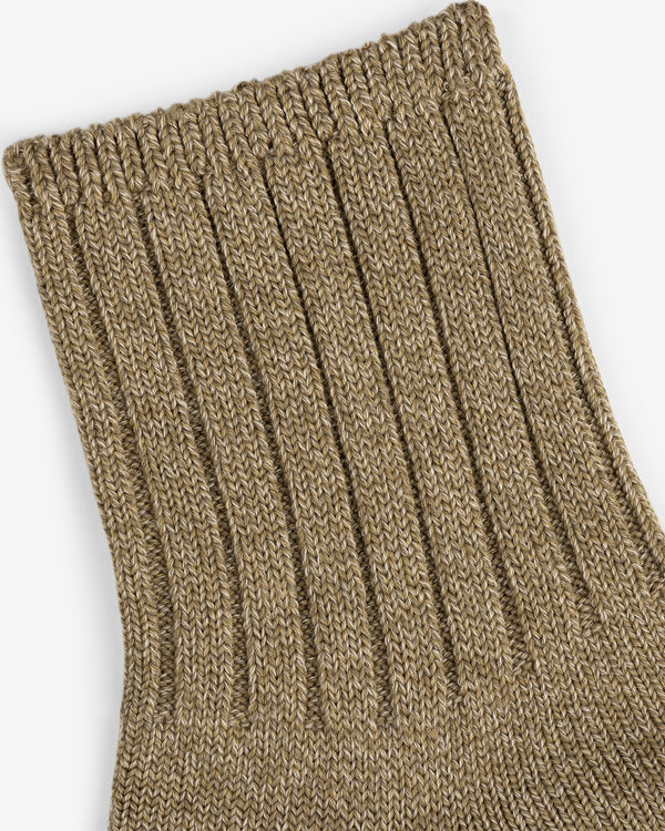 Close-up of a ribbed, tan Marled Quarter Sock fabric, likely the cuff, shown on a white background.